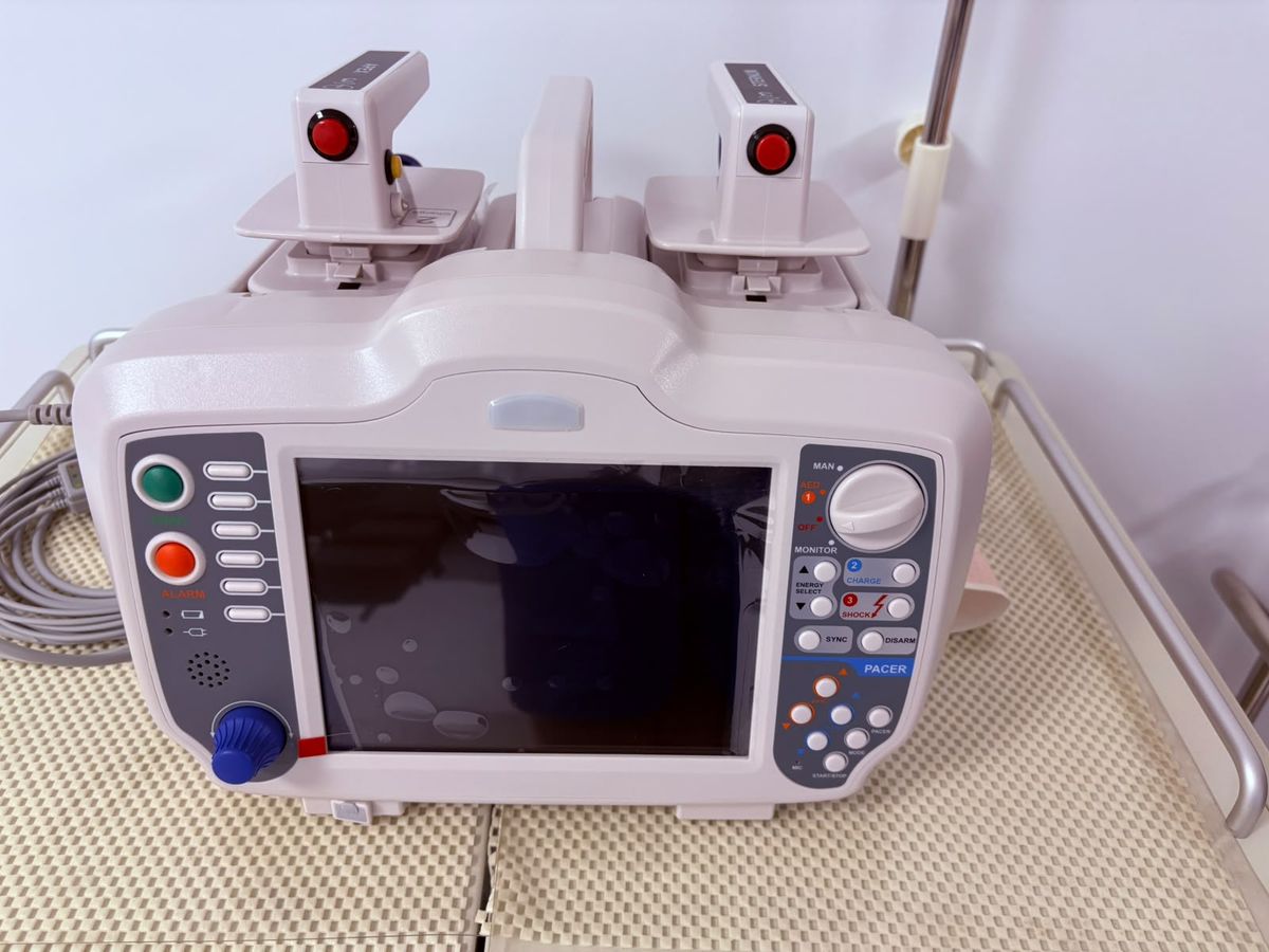 A defibrillator and patient monitor on a trolley