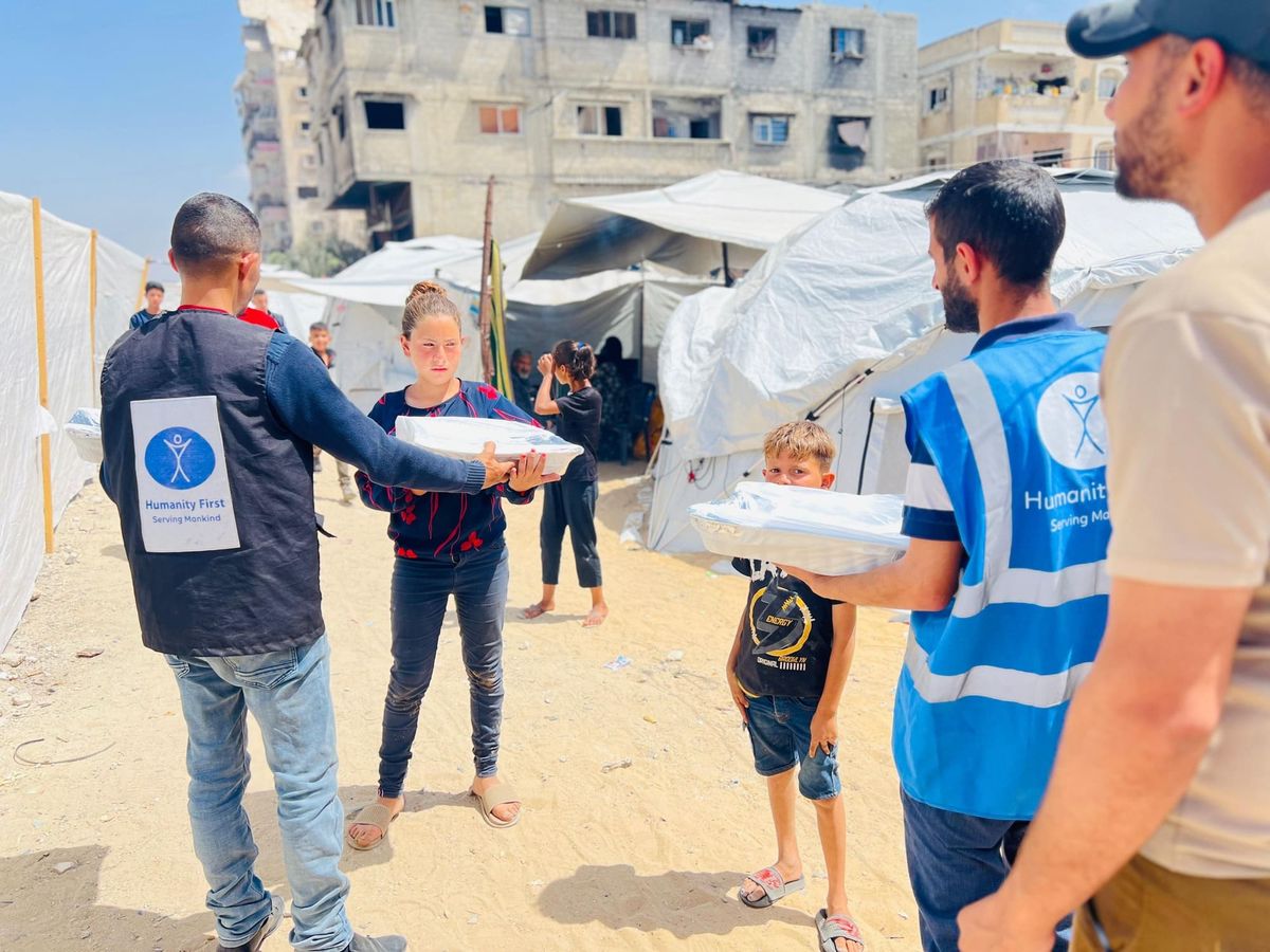Distributing food aid to families in Gaza