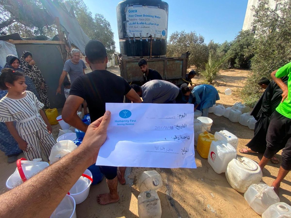 A Humanity First water delivery in Gaza with a signed field log recording the date and location