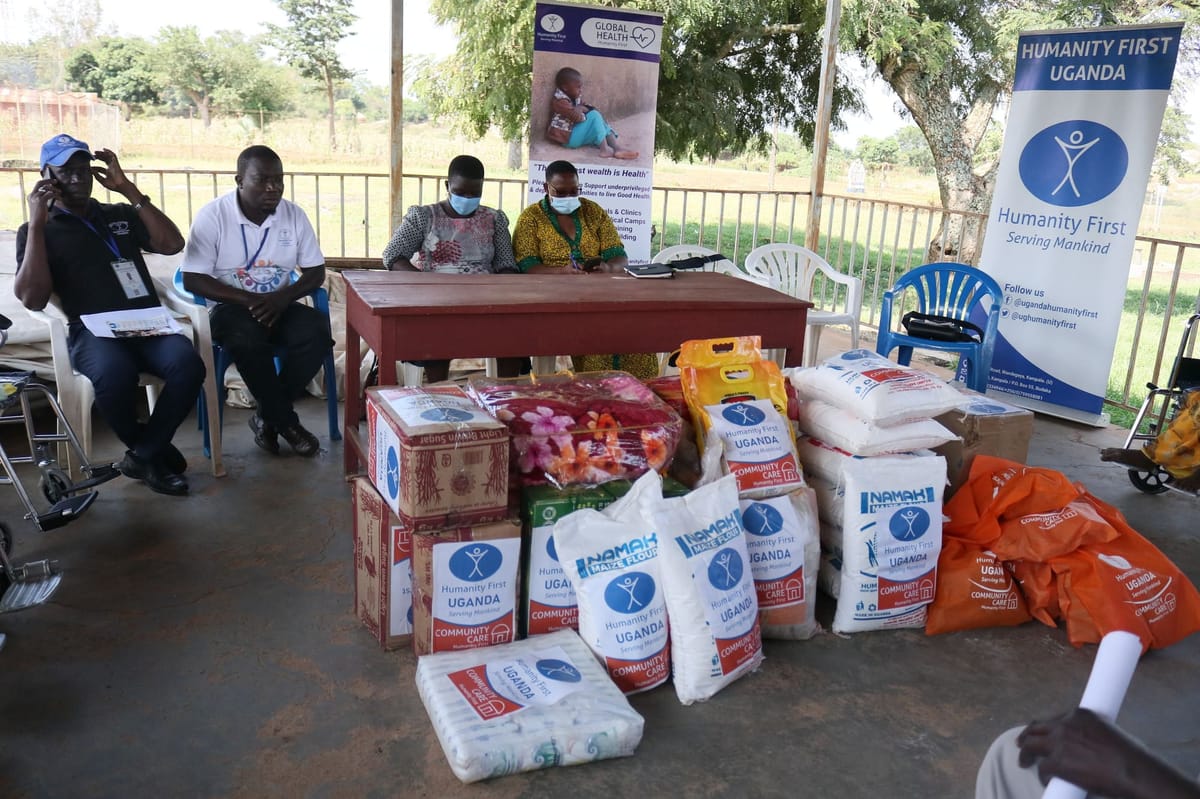 Distributing aid and essential items to families in Uganda