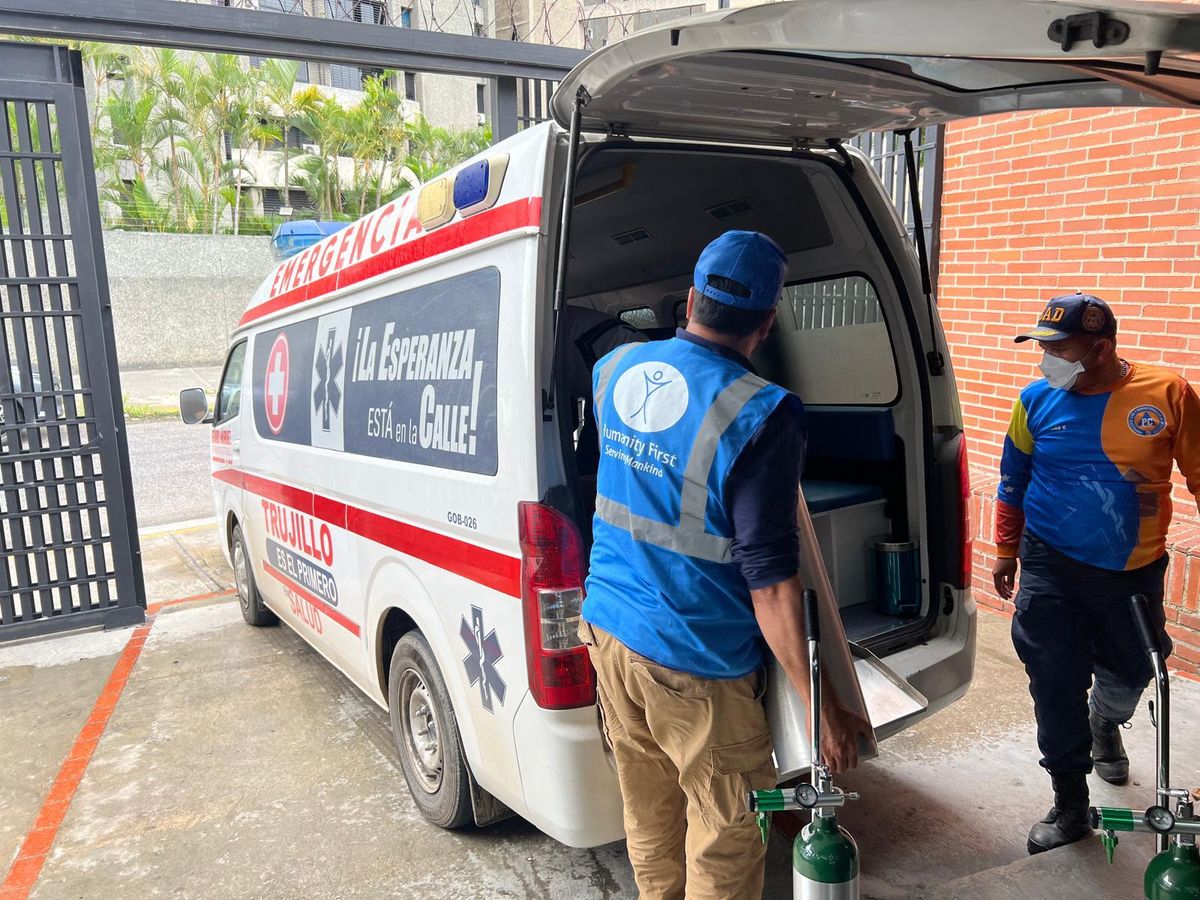 The Humanity First team loading aid into an ambulance in La Guaira