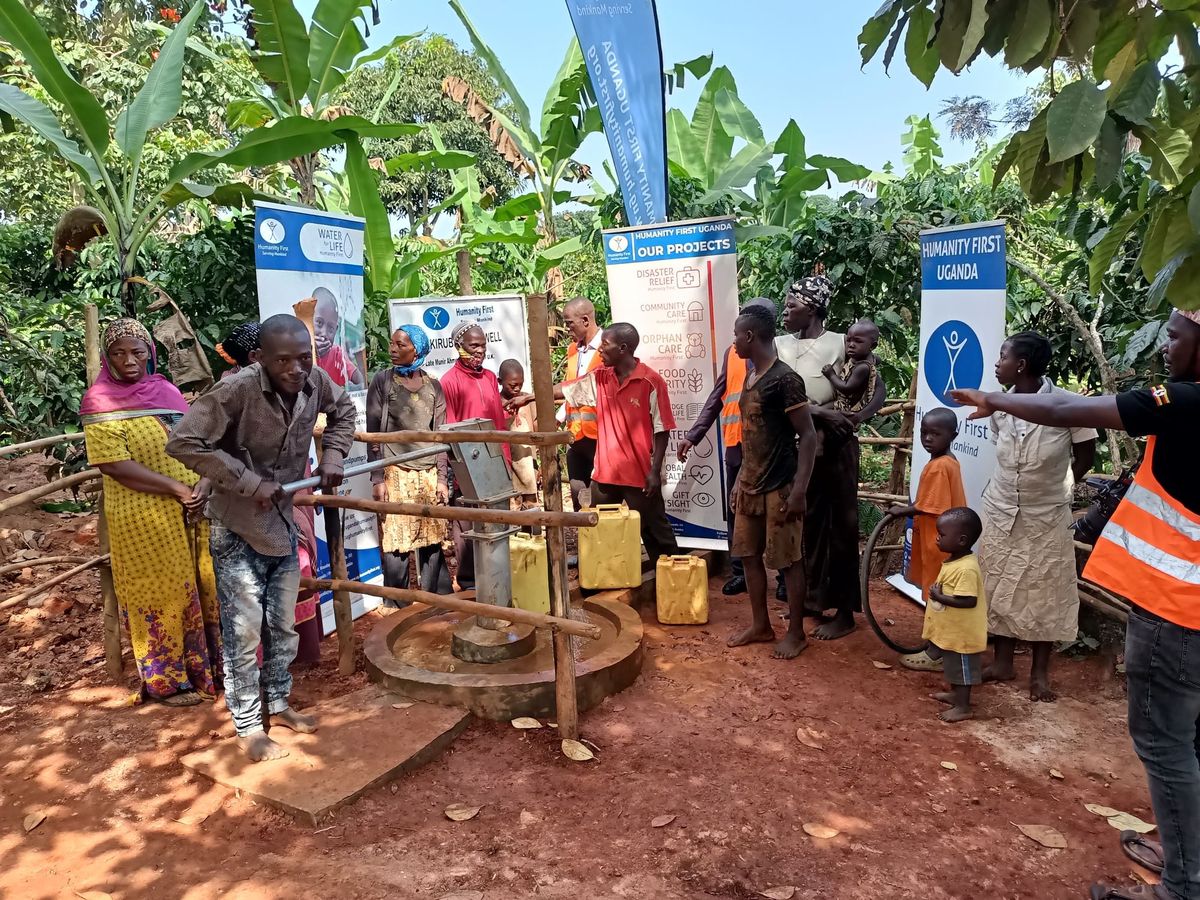 Children at a Humanity First UK water well in Uganda