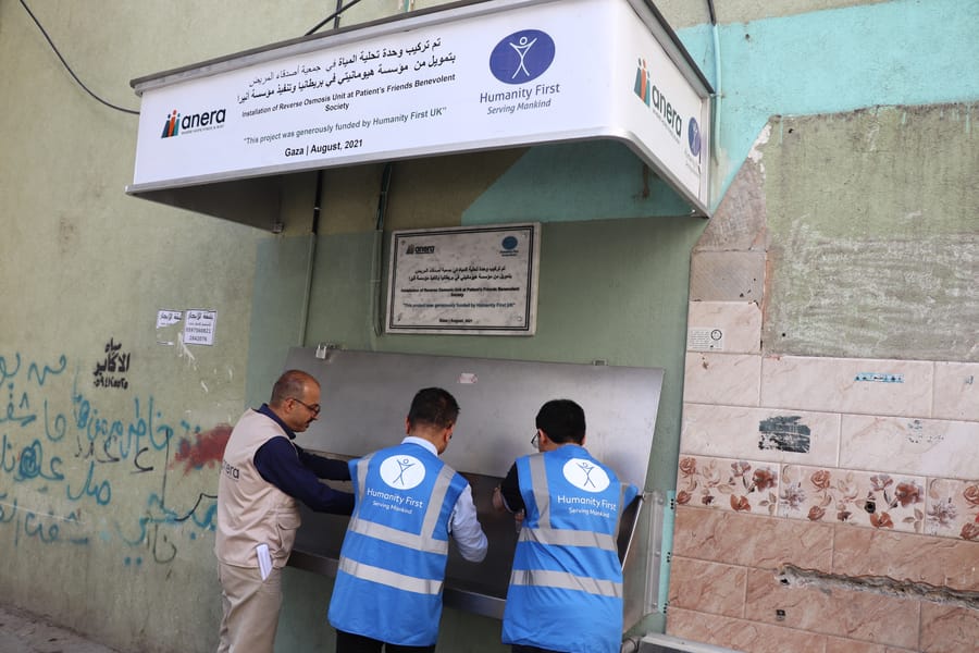 Humanity First staff at a reverse osmosis water point at a Gaza health clinic